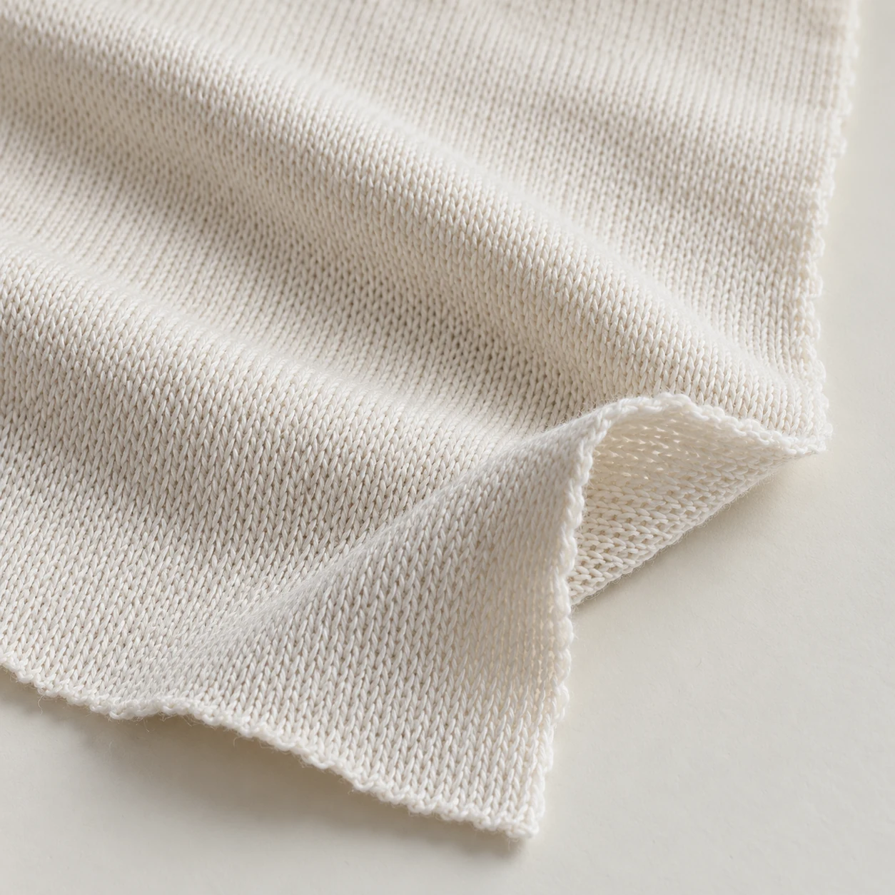 Representative performance single jersey texture; generated illustration.