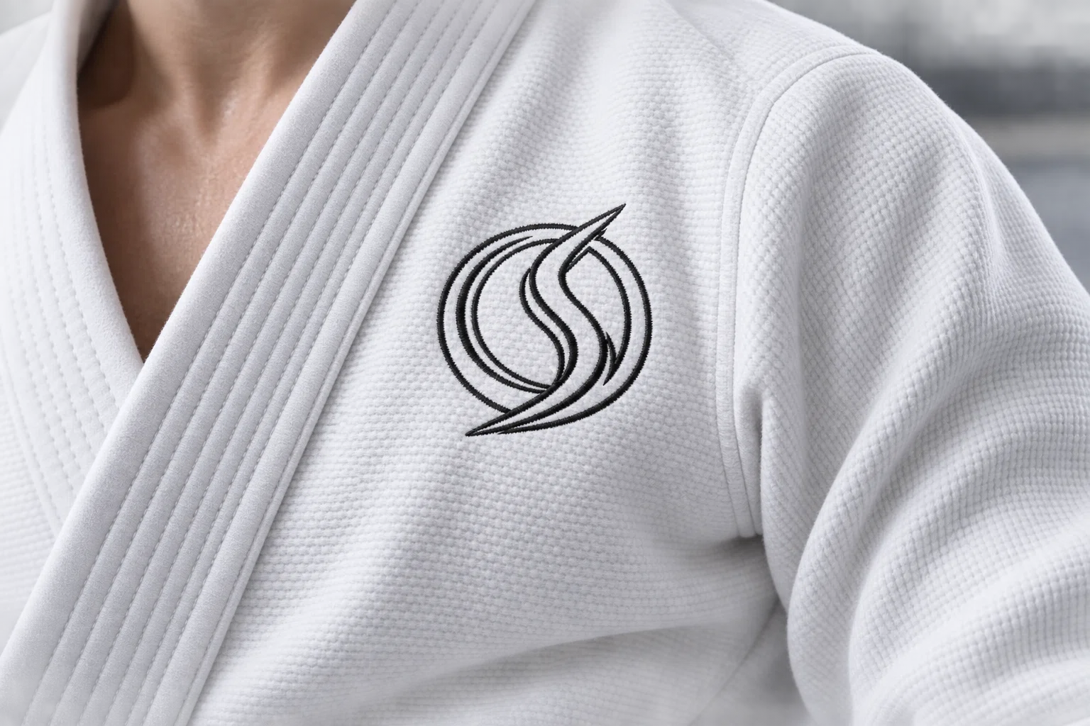 Close detail of woven white gi collar and stitching