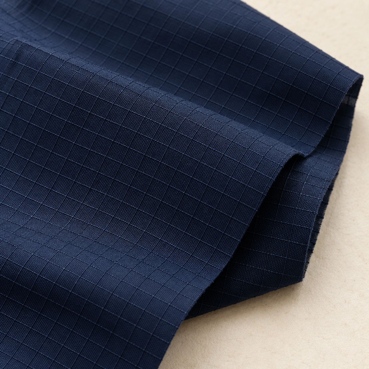 Representative synthetic ripstop woven texture; generated illustration.
