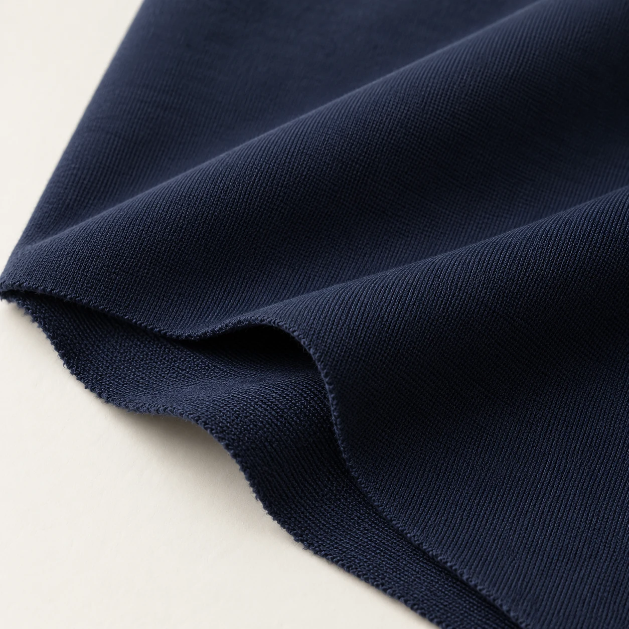 Representative polyester/elastane stretch knit texture; generated illustration.