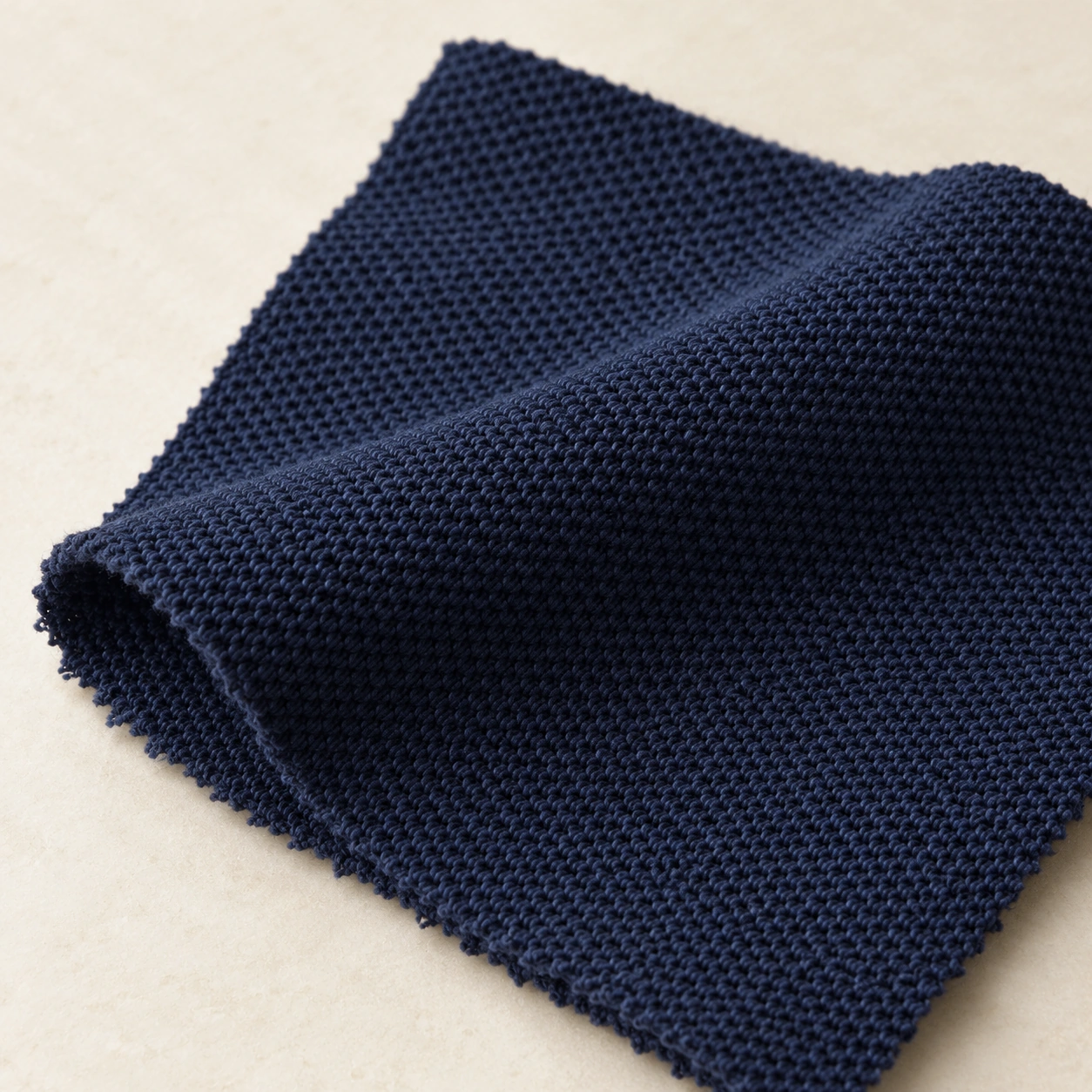 Representative pique polo knit texture; generated illustration.