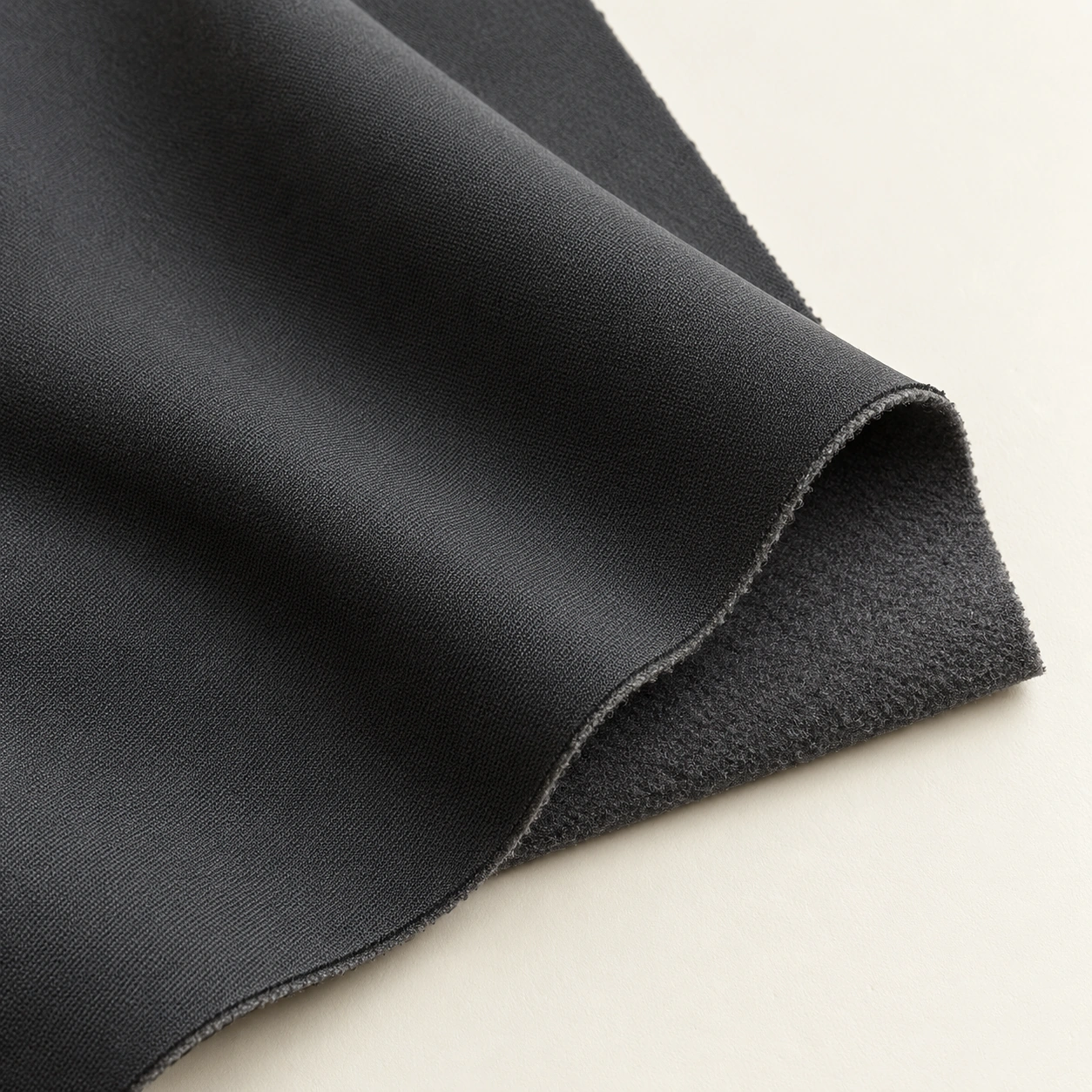 Representative bonded / laminated outerwear textile texture; generated illustration.
